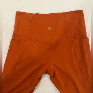 Athleta Salutation Stash Pocket II 7/8 Tight Burnt Orange